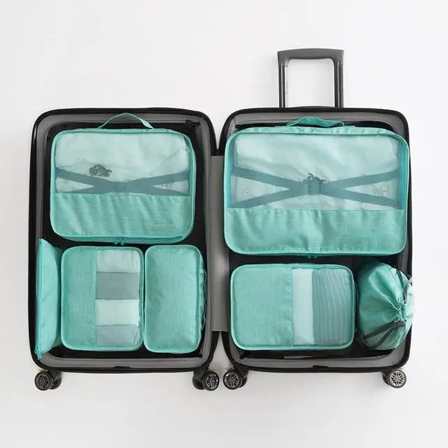 Set de 7 pochettes turquoise pour organiser une valise