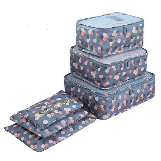 Ensemble de six pochettes de voyage bleues à motif floral