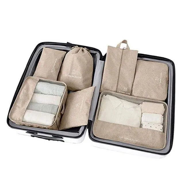 Ensemble de sept organiseurs de valise en nylon beige imperméable