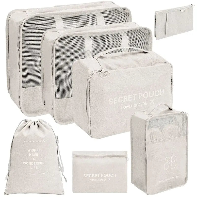 Set de pochettes beige pour compartimenter les bagages