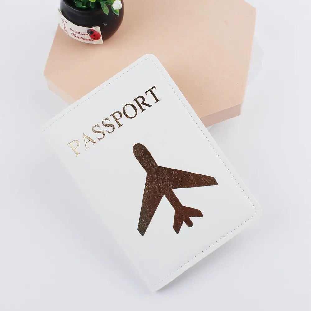 Protège-passeport blanc avec avion doré, vue de face