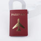 Protège-passeport bordeaux, avion doré en relief