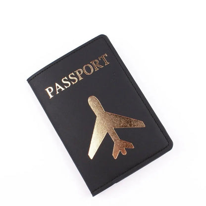 Étui noir pour passeport, avion doré sur la couverture