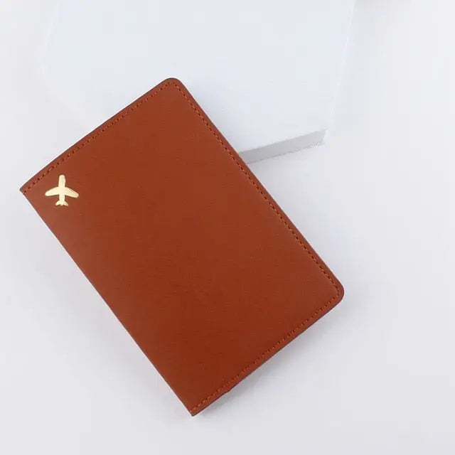 Protège-passeport marron en polyuréthane avec avion doré