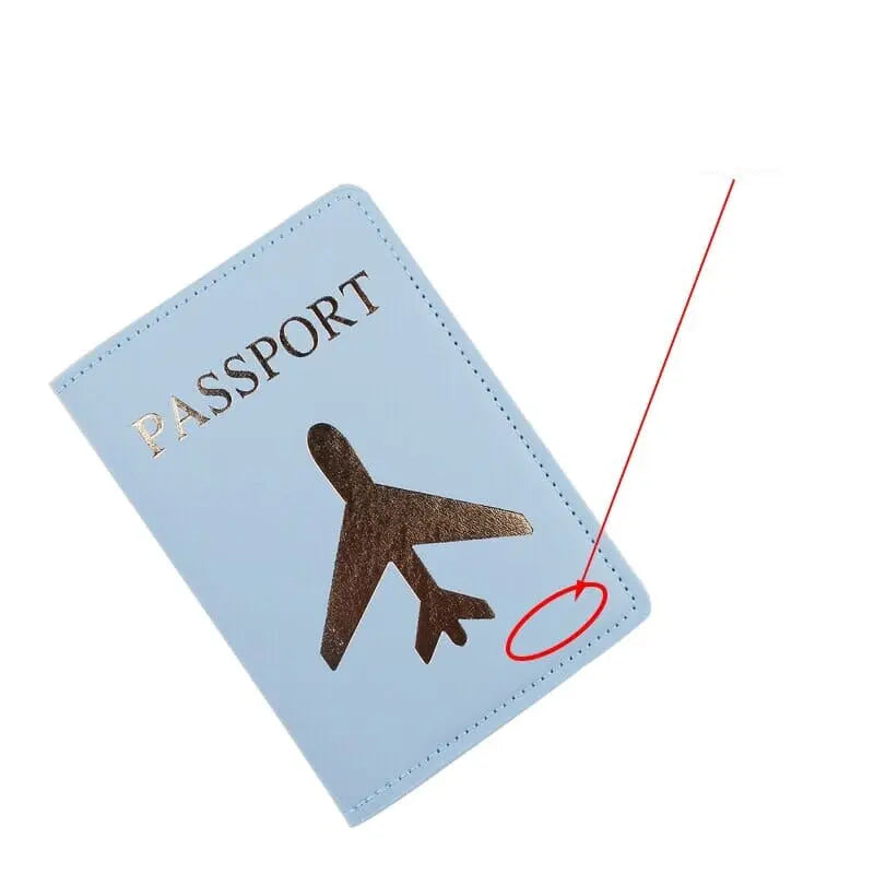 Protège-passeport bleu ciel avec avion doré