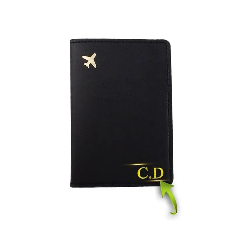 Étui passeport noir avec avion doré, texture en polyuréthane