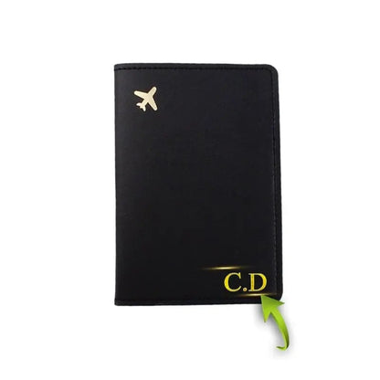 Étui passeport noir avec avion doré, texture en polyuréthane