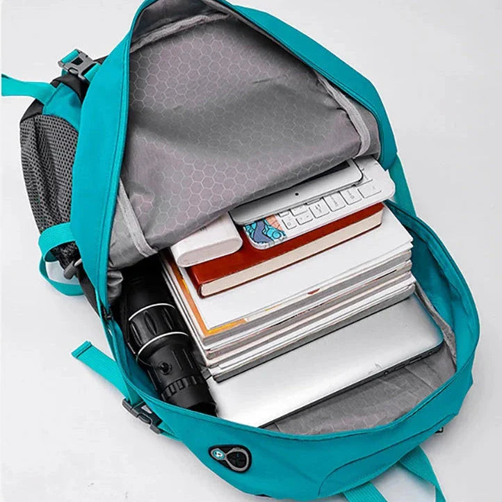 Vue de profil du sac à dos 40L, bretelles rembourrées visibles