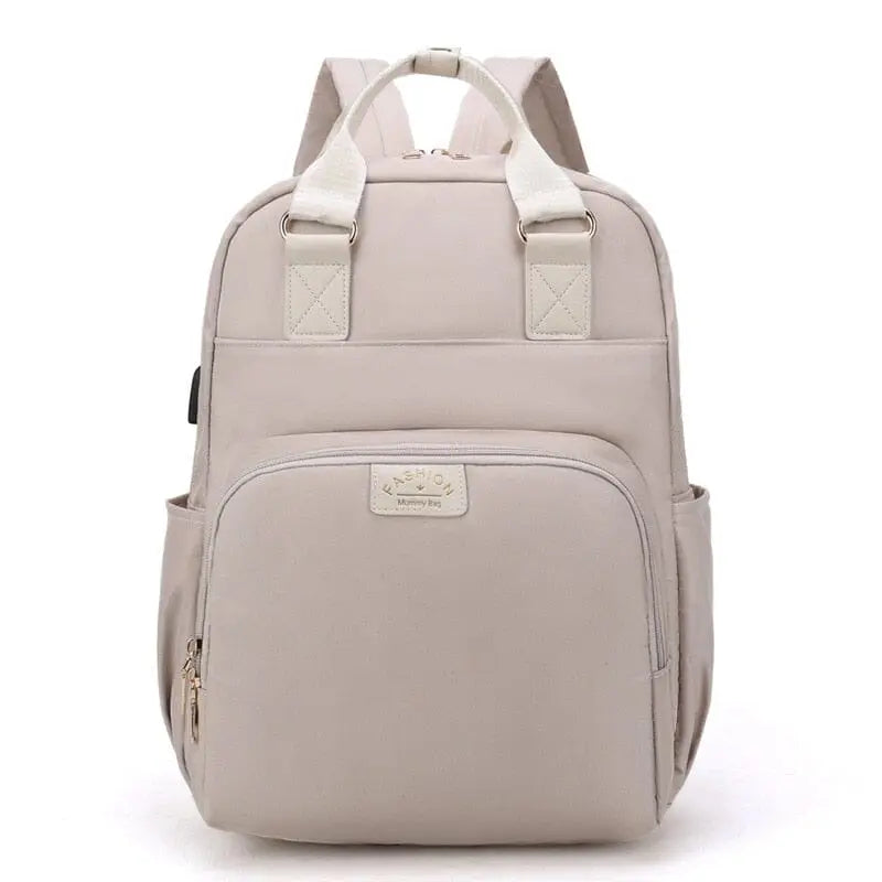 Modèle beige du sac à dos avec fermeture éclair visible