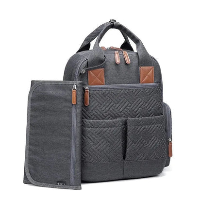 Sac à langer gris avec poches avant et latérales visibles