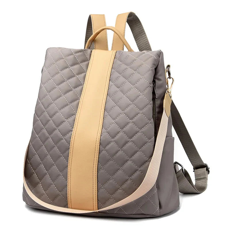 Sac à dos matelassé en gris et beige, élégant et sûr