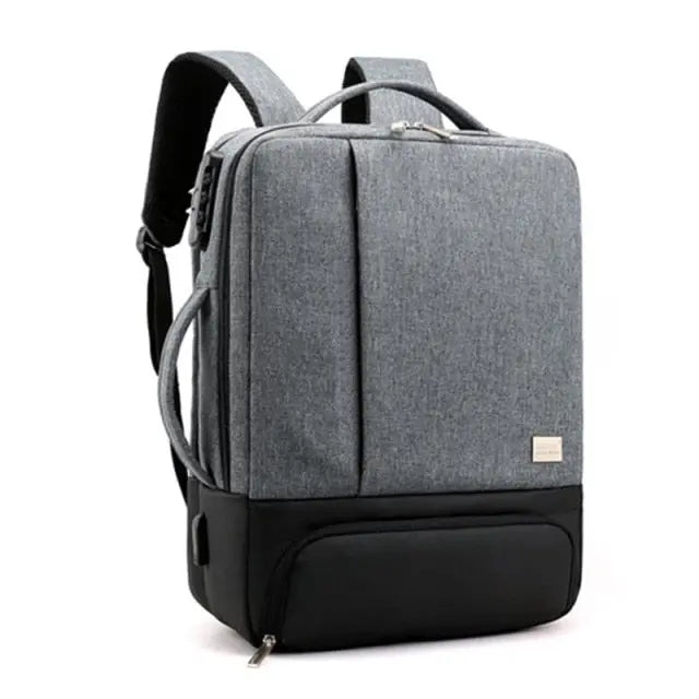 Sac à dos gris foncé avec multi-compartiments visibles