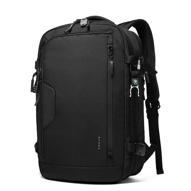 Sac à dos posé à côté d'une valise cabine