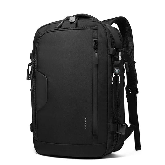 Sac à dos posé à côté d'une valise cabine