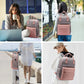 Sac à dos sur une valise, sangle arrière visible