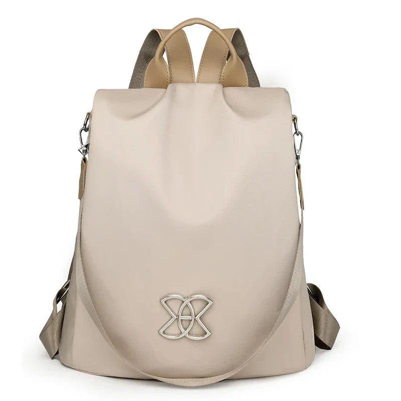 Sac à dos beige avec fermeture antivol au dos