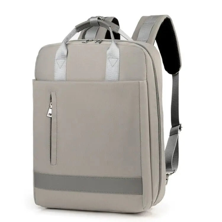 Vue de profil du sac à dos gris, détails des fermetures éclair