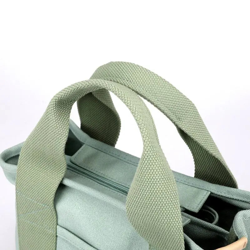 Vue latérale du sac en toile, bandoulière ajustable