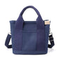 Sac bleu en toile, bandoulière détachable et poches extérieures