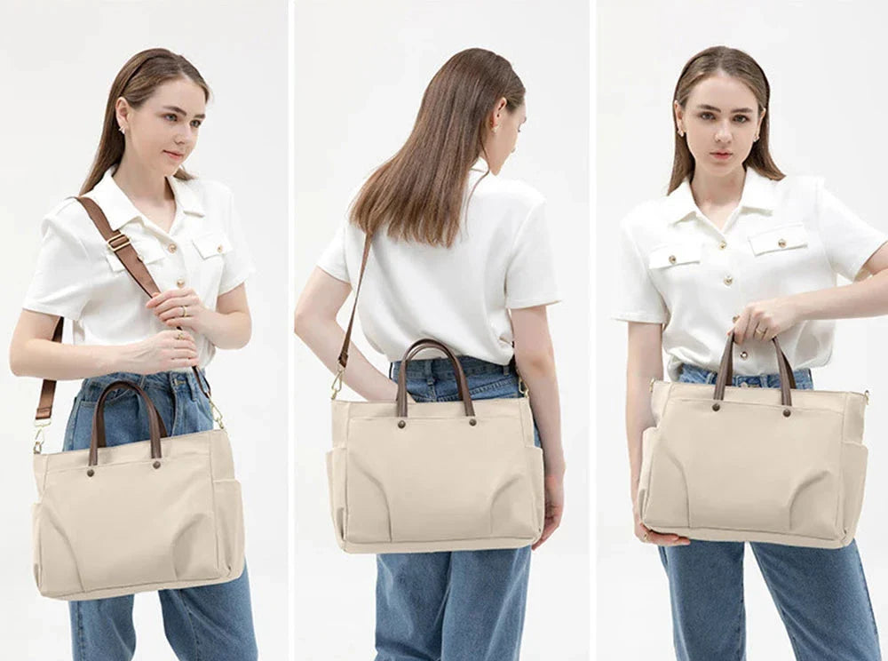 Sac cabas sur une valise grâce à la sangle arrière