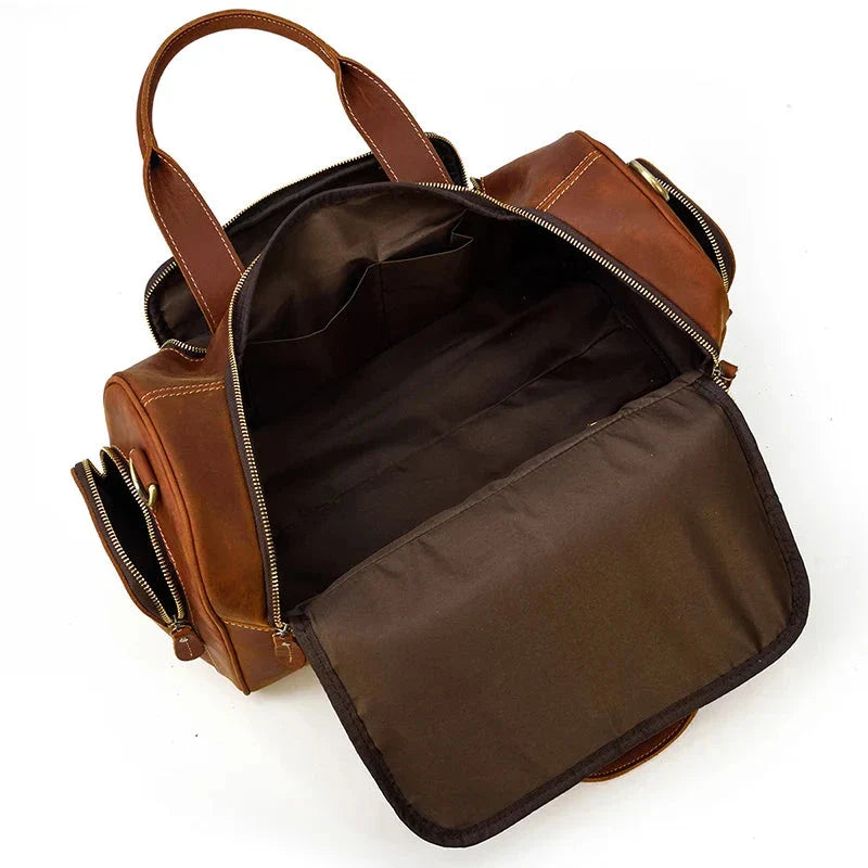 Vue de côté du sac en cuir marron avec poignées renforcées