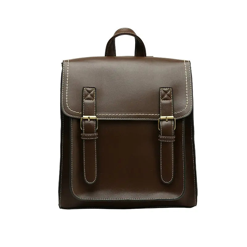 Sac à dos vintage en PU marron posé sur une table