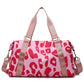 Sac de voyage léopard avec détails roses, idéal pour les week-ends