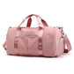 Sac de voyage rose avec compartiments et poignées