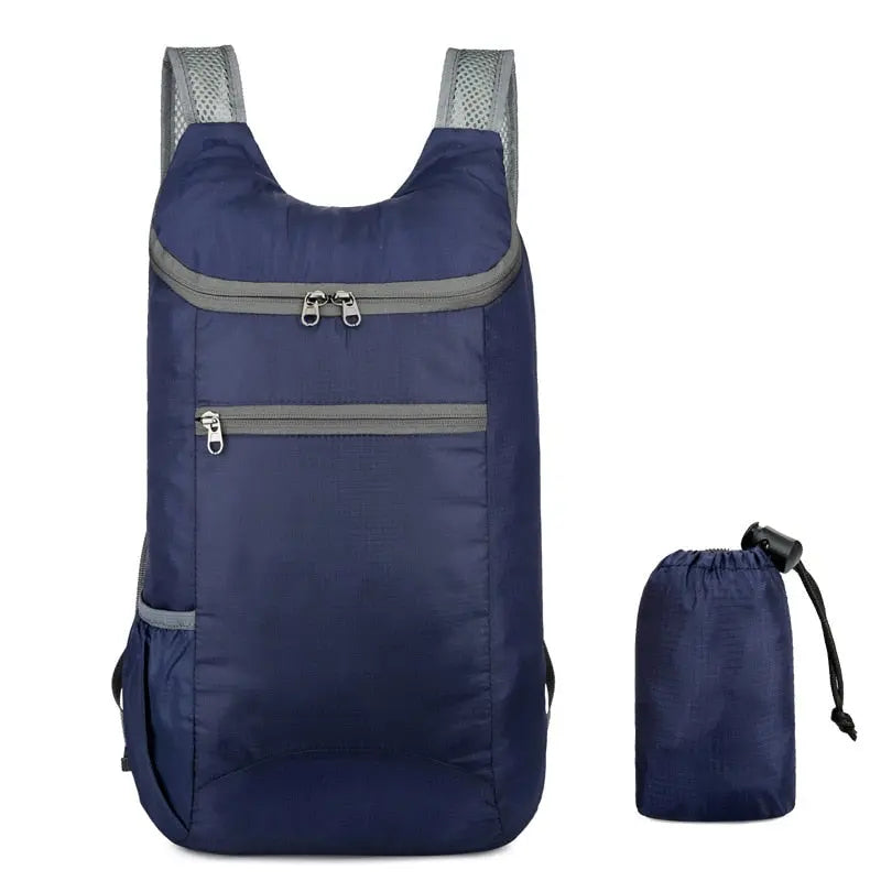 Sac à dos bleu foncé, vue de dessus montrant les fermetures