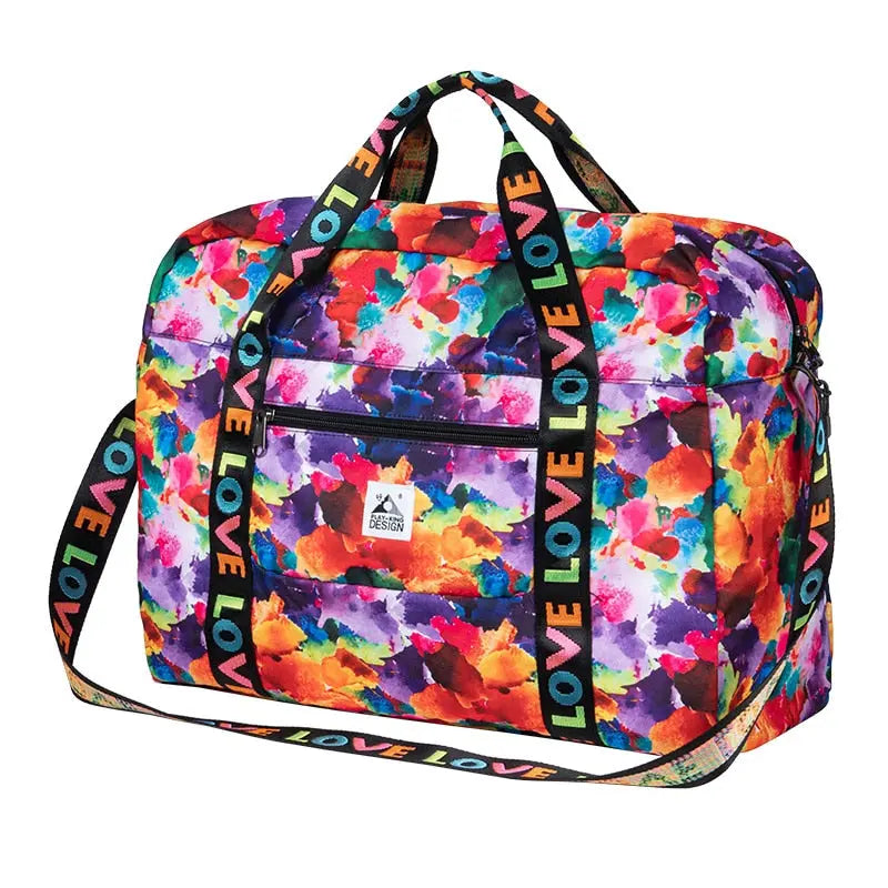 Sac de voyage plié avec motif floral coloré