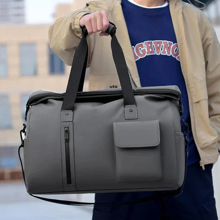 Vue en perspective du sac imperméable, bandoulière attachée