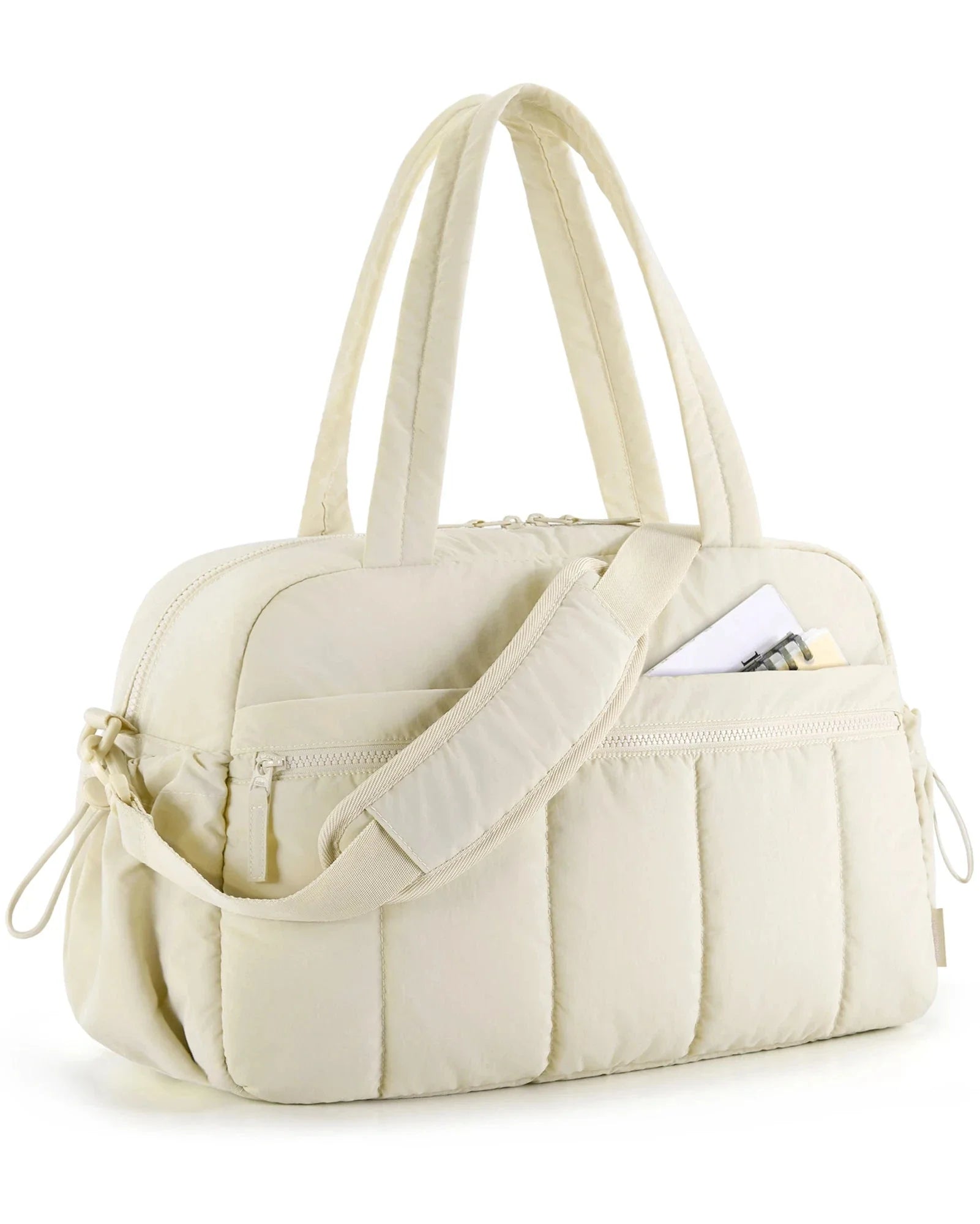 Sac matelassé beige, élégant et pratique pour voyages