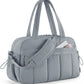 Sac gris matelassé, résistant et confortable à porter