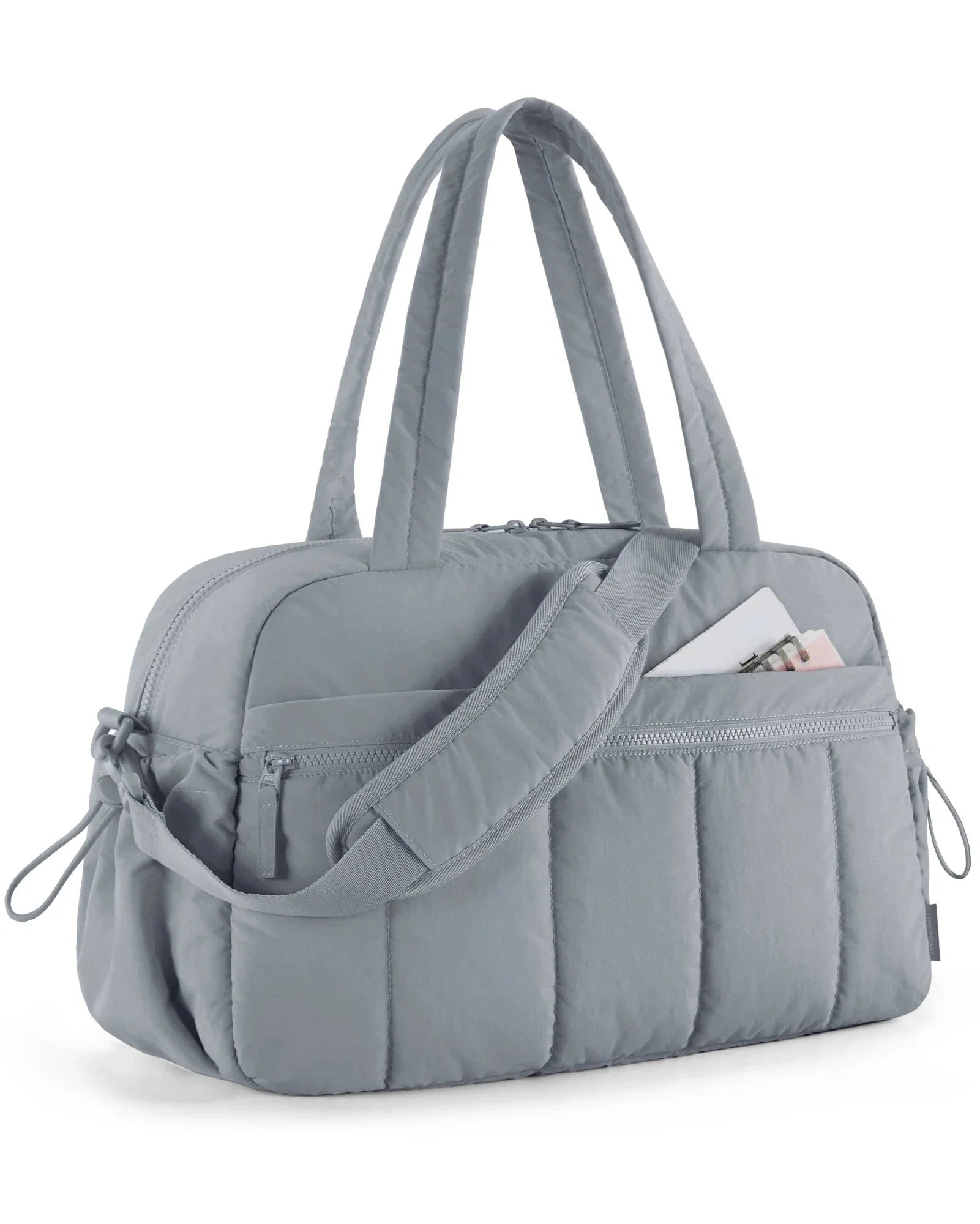Sac gris matelassé, résistant et confortable à porter