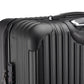 Trois valises noires rigides avec serrure TSA alignées