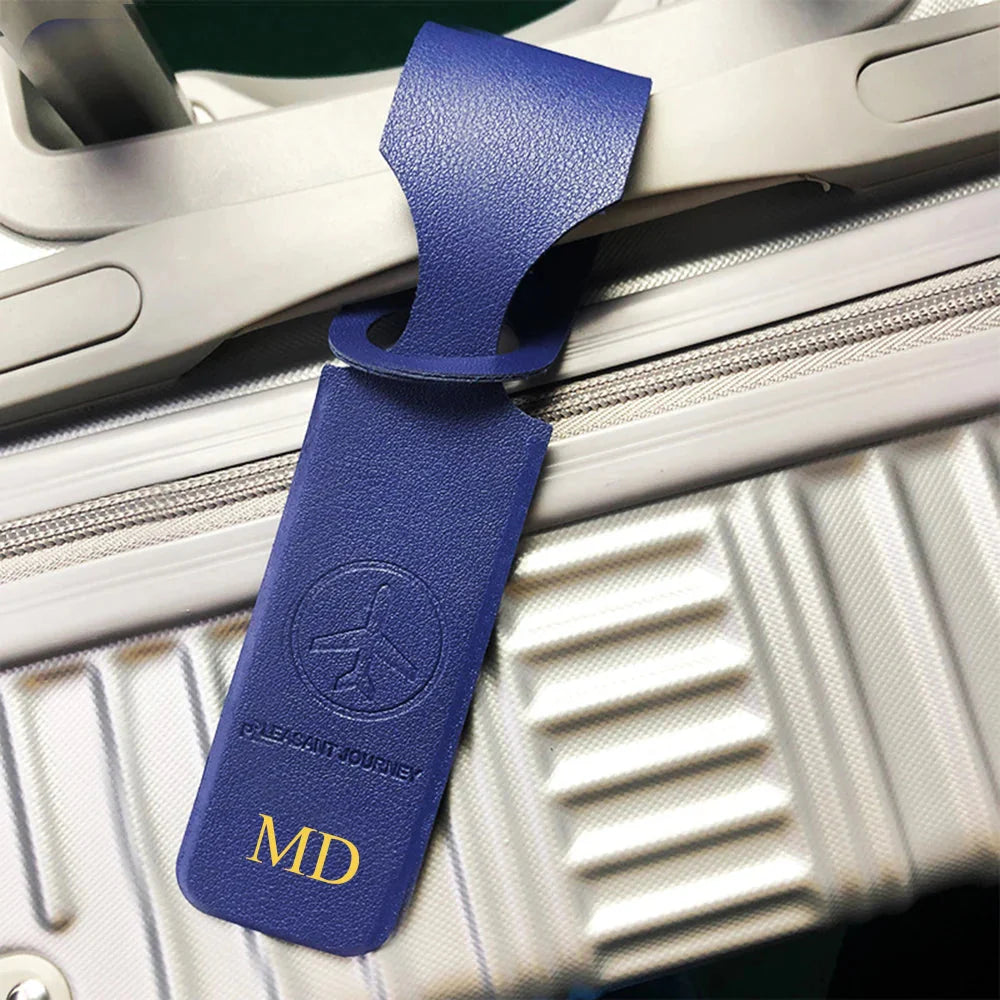 Étiquette de voyage bleu marine avec personnalisation dorée