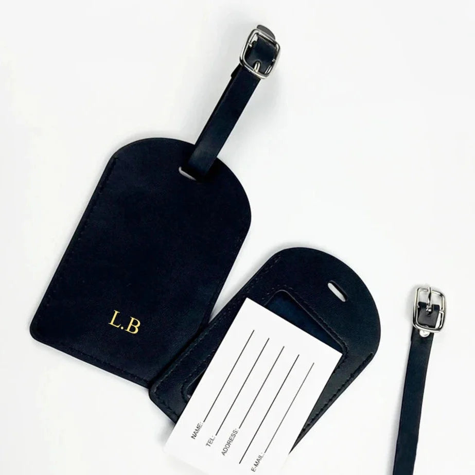Tag bagage noir avec lettres dorées élégantes