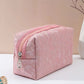 Vue latérale de la trousse avec motif floral