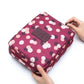 Vue latérale de la trousse de voyage à motif floral