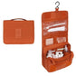 Trousse de toilette orange, format compact et pratique