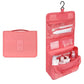 Trousse de toilette rose, compartiments bien organisés