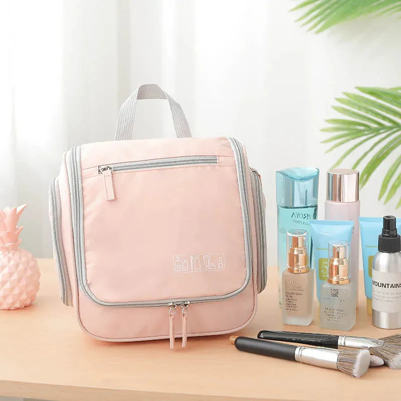 Trousse de toilette rose avec crochet intégré