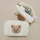 Vue de côté d'une trousse de toilette enfant avec ourson
