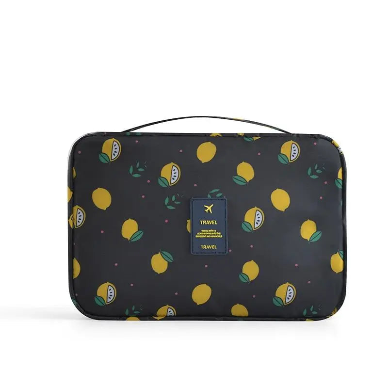 Trousse de toilette noire avec motif citrons, vue de côté