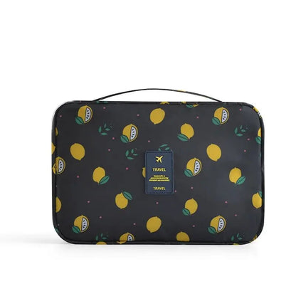 Trousse de toilette noire avec motif citrons, vue de côté