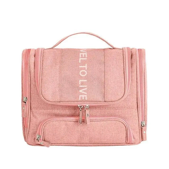 Trousse de toilette rose avec poignée et plusieurs sections