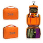 Vue de côté d'une trousse orange avec plusieurs poches