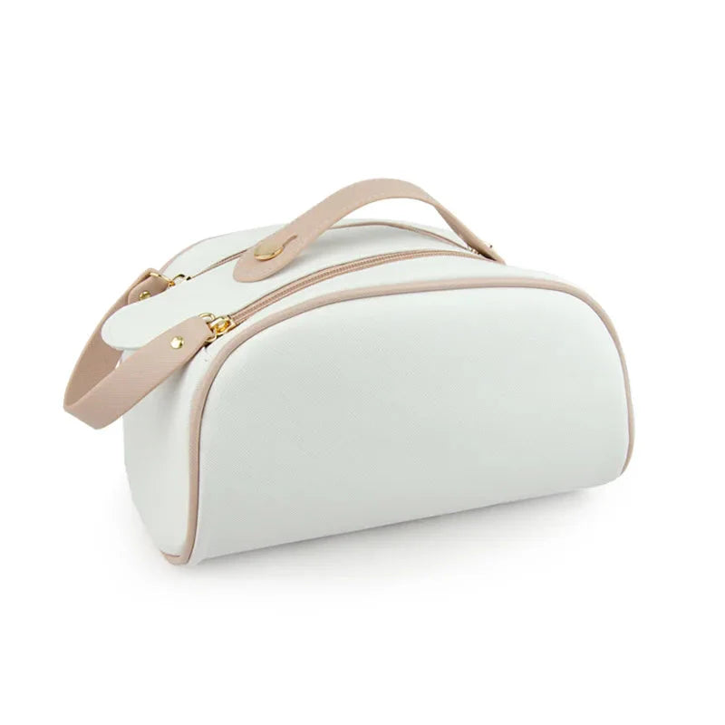 Trousse de toilette crème avec détails dorés, design raffiné