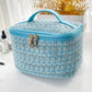 Trousse de toilette bleue avec fermeture à zip et poignée