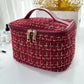 Trousse de toilette bordeaux avec texture en nylon résistant